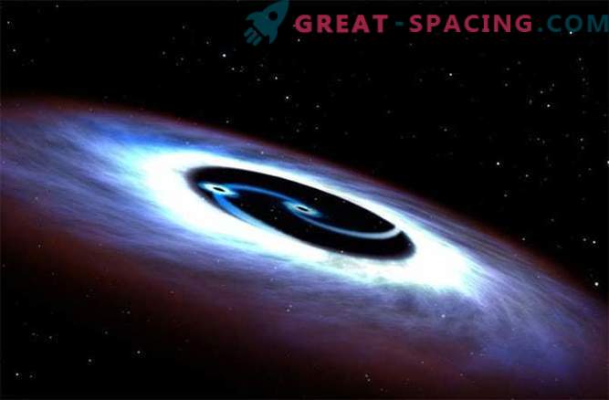Juodosios skylės sukasi aplink kvazarą mirtingame mūšyje
